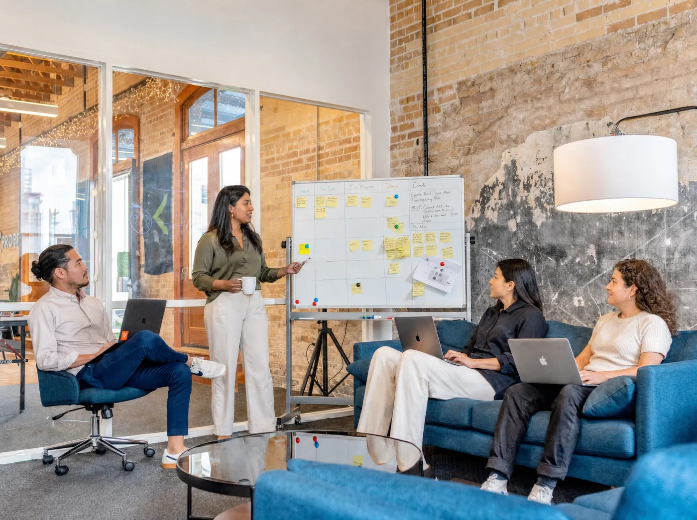 A diverse team mapping out a local marketing plan at a whiteboard